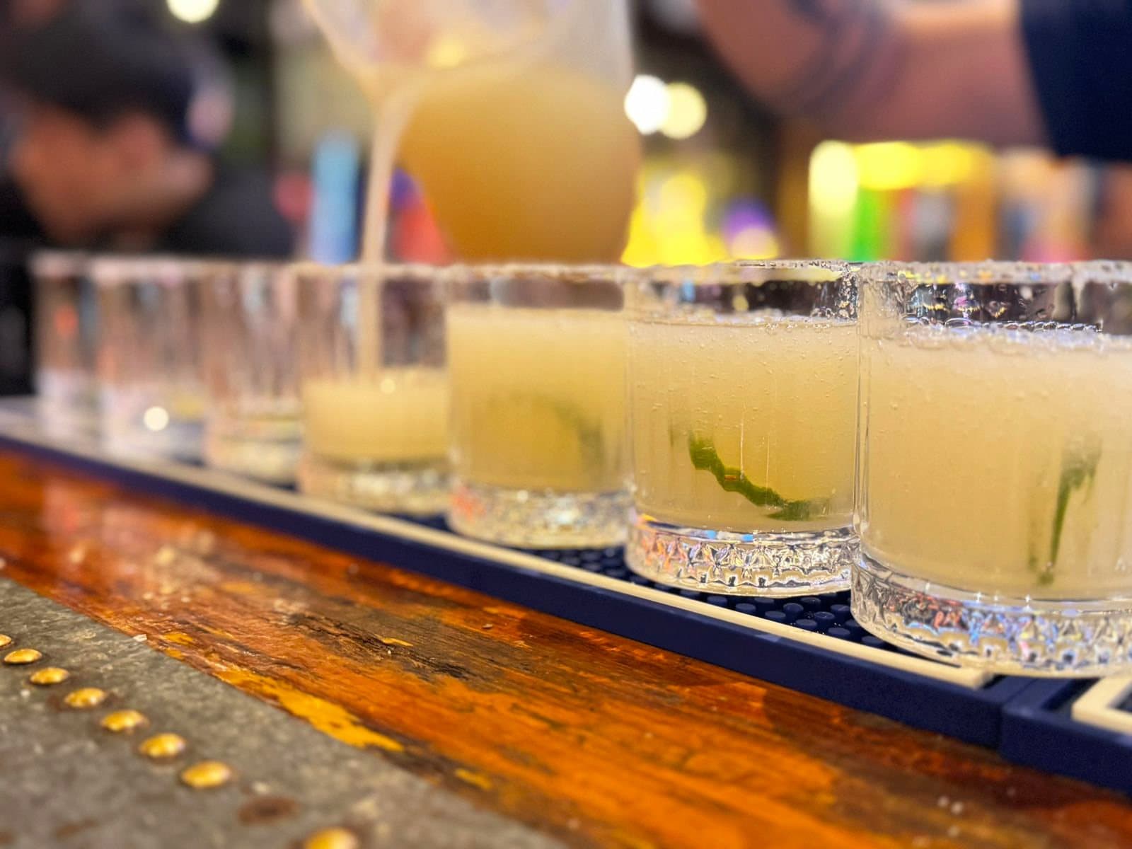 Margaritas lined up along the bar at Dirty Fingers.